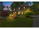 Charming home featuring a landscaped front yard and inviting curb appeal with a brick facade at 5725 Lake Oak Lndg, Cumming, GA 30040