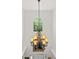 View of a foyer with a large chandelier, high ceilings, and arched window with backyard views at 5725 Lake Oak Lndg, Cumming, GA 30040