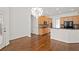 Open kitchen with an eat-in bar area and chandelier lighting at 5725 Lake Oak Lndg, Cumming, GA 30040