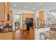 Bright kitchen with stainless steel appliances, granite counters, and bar seating at 5725 Lake Oak Lndg, Cumming, GA 30040