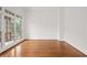 Bright living room featuring hardwood floors and large window views at 5725 Lake Oak Lndg, Cumming, GA 30040