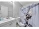 Bathroom featuring modern fixtures, a shower curtain with art, and a coordinating toilet seat cover at 6057 Dorchester Dr, Rex, GA 30273