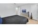 Bedroom with wood floor, a TV on the dresser, and a door to a walk-in closet at 6057 Dorchester Dr, Rex, GA 30273
