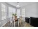 Bright dining area with modern lighting and large windows at 6057 Dorchester Dr, Rex, GA 30273