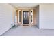 Covered front porch and front door of home with views of the front yard at 6057 Dorchester Dr, Rex, GA 30273