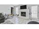 Living room featuring a fireplace, tile floors, and access to the backyard at 6057 Dorchester Dr, Rex, GA 30273