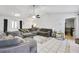 Spacious living room with tile flooring and neutral walls with entry to other rooms at 6057 Dorchester Dr, Rex, GA 30273