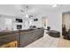 Spacious living room with tile flooring, fireplace, and plenty of natural light at 6057 Dorchester Dr, Rex, GA 30273