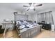 Main bedroom with ceiling fan and large bed at 6057 Dorchester Dr, Rex, GA 30273