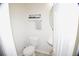Cozy half bathroom with white fixtures, modern towel rack, and medicine cabinet at 1371 Blazing Star Rd, Lawrenceville, GA 30045
