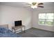 Cozy bedroom with a ceiling fan, window with blinds, and carpeted flooring at 1371 Blazing Star Rd, Lawrenceville, GA 30045
