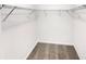 A simple walk-in closet with wire shelving for storage and gray carpeted floor at 1371 Blazing Star Rd, Lawrenceville, GA 30045