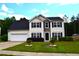 Beautiful two-story home featuring a well-kept lawn and a two-car garage at 1371 Blazing Star Rd, Lawrenceville, GA 30045