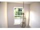 Foyer with a hanging light fixture and a large bright window at 1371 Blazing Star Rd, Lawrenceville, GA 30045