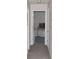 Bright hallway featuring neutral paint and a view into the nearby room at 1371 Blazing Star Rd, Lawrenceville, GA 30045