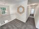 Second story landing with a large accent mirror, railing, and hallway at 1371 Blazing Star Rd, Lawrenceville, GA 30045