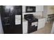 Kitchen featuring stainless steel appliances, black gas range and granite counter tops at 1371 Blazing Star Rd, Lawrenceville, GA 30045