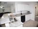 Modern kitchen with granite countertops and white cabinetry at 1371 Blazing Star Rd, Lawrenceville, GA 30045