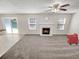 Bright living room featuring a cozy fireplace and neutral decor at 1371 Blazing Star Rd, Lawrenceville, GA 30045