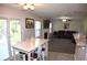 Open-concept floor plan combining dining and living areas with fireplace and sliding doors at 1371 Blazing Star Rd, Lawrenceville, GA 30045