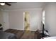 Bedroom leading to an attached half-bathroom with updated fixtures and neutral paint at 1371 Blazing Star Rd, Lawrenceville, GA 30045