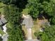 Aerial view of the property shows mature trees surrounding the residence at 2442 Falcon Ct, Lawrenceville, GA 30043
