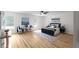 Spacious bedroom featuring stylish decor, plush bedding, and ample natural light at 2442 Falcon Ct, Lawrenceville, GA 30043