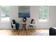 Bedroom space with hardwood floors, seating area, and natural light at 2442 Falcon Ct, Lawrenceville, GA 30043