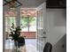 Bright dining area features an open doorway that leads to a covered, screened-in porch at 2442 Falcon Ct, Lawrenceville, GA 30043