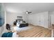 Expansive main bedroom showcasing wood floors, a walk-in closet, and an ensuite bathroom at 2442 Falcon Ct, Lawrenceville, GA 30043
