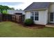 Backyard with wooden fence, lush grass and decorative landscaping, providing a serene outdoor space at 282 Ellesmere Court, Buford, GA 30518