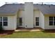 A home's backyard patio and lawn feature a well-kept lawn at 282 Ellesmere Court, Buford, GA 30518
