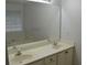 Bathroom featuring double sinks, white cabinets, and a large mirror at 282 Ellesmere Court, Buford, GA 30518