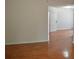 Hardwood hallway with a white door leading to another room at 282 Ellesmere Court, Buford, GA 30518