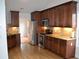 Well-equipped kitchen with granite countertops, stainless steel appliances, and wooden cabinetry at 282 Ellesmere Court, Buford, GA 30518