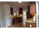 Well-equipped kitchen with granite countertops, stainless steel appliances, and wooden cabinetry at 282 Ellesmere Court, Buford, GA 30518