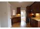 Well-equipped kitchen with granite countertops, stainless steel appliances, and wooden cabinetry at 282 Ellesmere Court, Buford, GA 30518