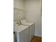 Functional laundry room with washer and dryer, offering convenience for daily chores at 282 Ellesmere Court, Buford, GA 30518
