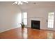 Bright living room with hardwood floors, fireplace, and natural light at 282 Ellesmere Court, Buford, GA 30518