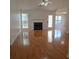 Bright living room with hardwood floors, fireplace, and natural light from the front door at 282 Ellesmere Court, Buford, GA 30518