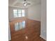 Main bedroom with hardwood floors, ceiling fan and natural light at 282 Ellesmere Court, Buford, GA 30518