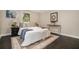 The bedroom includes dark floors, a patterned rug, and a large bed with neutral and blue accents at 376 Pine Ne St, Marietta, GA 30060