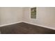 This bedroom has dark wood floors and white trim with one window at 376 Pine Ne St, Marietta, GA 30060
