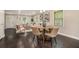 Cozy dining area with hardwood floors, modern lighting, and an open view into the living space at 376 Pine Ne St, Marietta, GA 30060