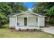 Charming cottage-style home features a cozy front porch with a swing, perfect for relaxing outdoors at 376 Pine Ne St, Marietta, GA 30060