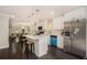 Bright kitchen with a center island, modern appliances, and an open view to the dining and living areas at 376 Pine Ne St, Marietta, GA 30060