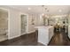 Modern kitchen featuring a center island, white cabinets, and stainless steel appliances at 376 Pine Ne St, Marietta, GA 30060