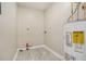 Utility room featuring tile floors and a water heater at 376 Pine Ne St, Marietta, GA 30060