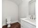 Clean and modern powder room featuring a white vanity and updated fixtures at 8210 Sonata Ln, Cumming, GA 30041