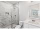 Contemporary bathroom with a marble tiled walk-in shower, white vanity and modern fixtures at 8210 Sonata Ln, Cumming, GA 30041